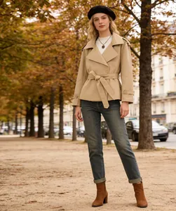 Detailed view of a stylish khaki short trench coat with an adjustable waist belt.
