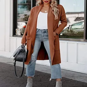 Stylish women's long camel open-front coat paired with distressed jeans in urban street view