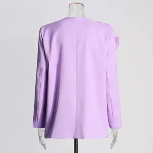 Back view of a lavender women blazer featuring a ruffled shoulder detail on a mannequin.