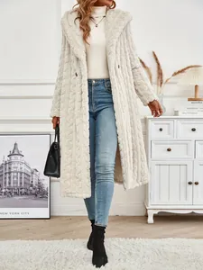 Cozy cream-colored long hooded faux-fur coat styled with blue jeans and black boots.