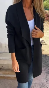 Detailed close-up of a black mid-length lapel knitted cardigan worn by a model
