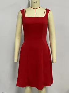 Detailed shot of an elegant red square neck sleeveless A-line dress on a mannequin