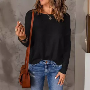 Casual women's black long sleeve knit sweater for autumn and winter fashion.