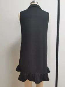 Detailed back view of a black sleeveless A-line dress featuring a ruffle hem decoration.