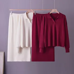 Comparison of cream and burgundy knit polo sweater and midi skirt sets for women.