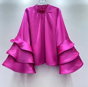 Elegant magenta satin blouse with multi-layered ruffle sleeves for a French chic look.