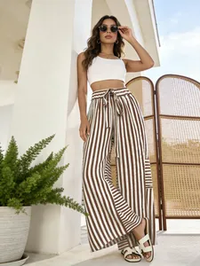 Summer style with women's high-waisted striped wide-leg pants and a white crop top