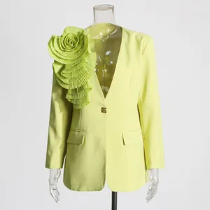 Detailed view of a lime green blazer featuring a large 3D pleated rose on the shoulder.