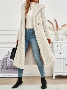 Close-up detail of a long cream hooded teddy coat styled with blue jeans and boots