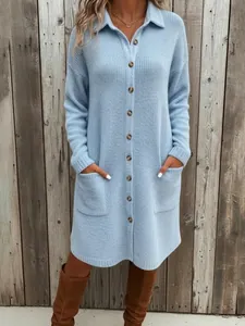 Full view of elegant light blue knitted polo neck sweater dress with button detail