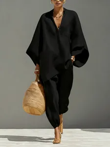 Elegantes schwarzes Freizeit-Set mit Oversize-Fledermausärmeln und tiefem V-Ausschnitt