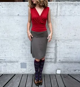 Full view of women's red cross V-neck slim-fit tank top with ruched waist detail