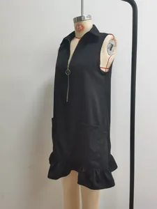 Detail view of black sleeveless A-line dress with half-zip V-neck and ruffled hemline