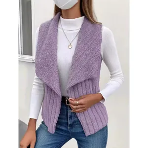 Stylish women's purple sleeveless vest with sherpa collar and ribbed texture on model