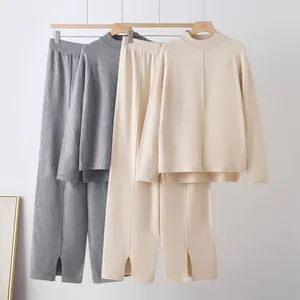 Cozy knitted two-piece set with oversized sweater and split-hem wide-leg pants on hangers