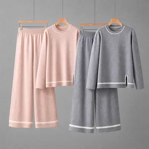 Pink and grey women's knitted two-piece sets with contrast stripes and side slits on hangers