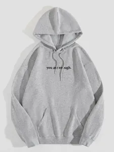 Detailed view of gray fleece hoodie with 'you are enough' print and kangaroo pocket