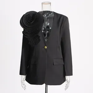 Elegant black slim-fit blazer featuring a large 3D pleated fabric flower on the shoulder