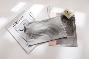 Close-up view of the ribbed texture on this seamless light gray bandeau bralette for women