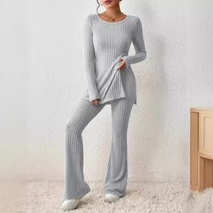 Elegant grey ribbed knit two-piece set with long sleeve top and flared pants for women.