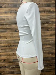 Side view of a white ribbed long-sleeve T-shirt with a slim fit and double U-neckline.