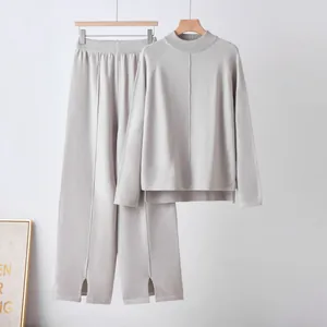 Elegant grey 2 piece knitwear set with mock neck sweater and split wide-leg trousers