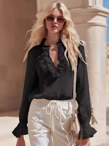 Elegant black linen blouse featuring a vintage French ruffle V-neck and flared cuffs