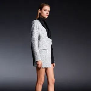 Elegant color-block blazer featuring unique silver sequin and black fabric contrast detail