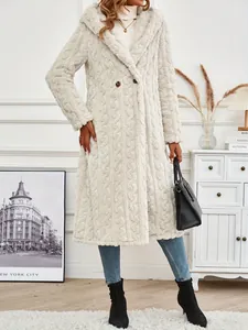 Full-body view of woman wearing elegant cream long hooded coat in a cozy modern indoor setting
