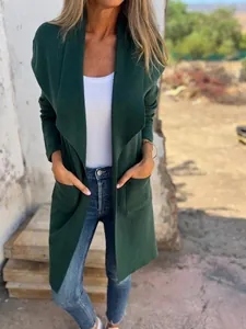 Full-length front view showing the fit of a dark green lapel knit cardigan coat