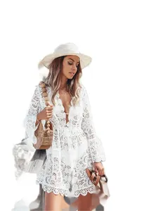 Elegant white floral lace beach cover-up featuring a deep V-neck and bell sleeves