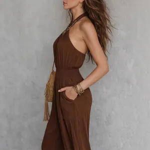 Elegant side view detail of brown bohemian sleeveless jumpsuit with smocked waist