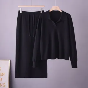 Sophisticated black knitted two-piece set featuring a polo collar sweater and midi skirt