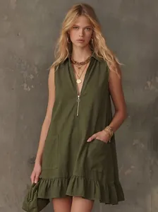 Full detail view of olive green A-line dress with V-neck zipper and ruffle hem