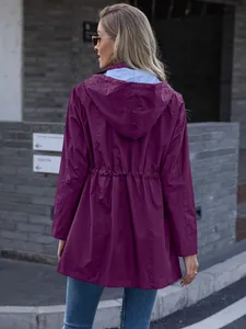 Back view of women's purple hooded raincoat with drawstring waist and striped lining.