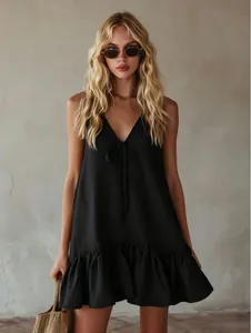 Chic black V-neck sleeveless resort dress with flounce hem and loose retro silhouette