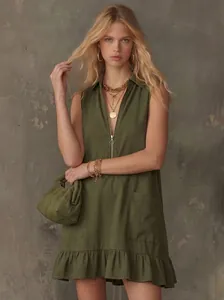 Detail of olive green sleeveless A-line dress with half-zip V-neck and ruffled hem.
