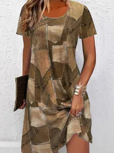 Detailed view of women's casual short sleeve T-shirt dress with faux denim patchwork print