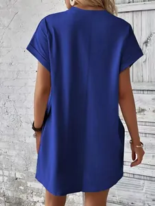 Back view of a vibrant blue loose short-sleeved summer dress with side pockets.