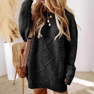 Detailed view of women oversized cable-knit sweater dress with chunky knit pattern