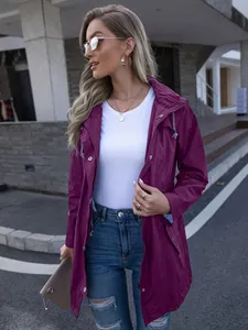 Stylish purple mid-length hooded raincoat jacket for women in urban street setting.