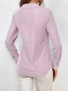 Back view of red vertical striped long-sleeve shirt with curved hem for women.