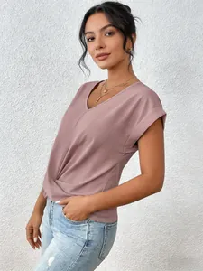 Detail of an elegant V-neck short sleeve mauve blouse with twisted hem