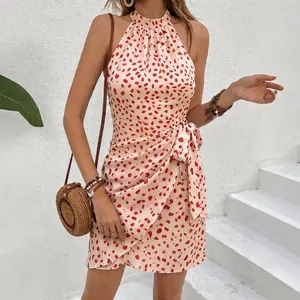 Stylish halter neck sleeveless floral print mini dress with wrap detail and tie waist