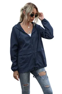 Detailed view of women's navy hooded windbreaker jacket with zipper and drawstrings