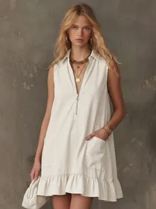 Elegant sleeveless A-line mini dress featuring a front zipper and ruffle hem detail.