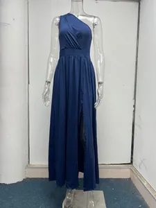 Detail view of navy blue one-shoulder maxi dress with a sexy high waist and leg slit.