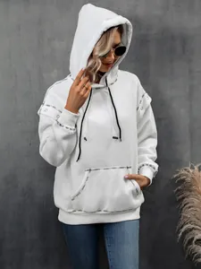 Close-up detail view of white raglan sleeve hoodie with black contrast stitching detail
