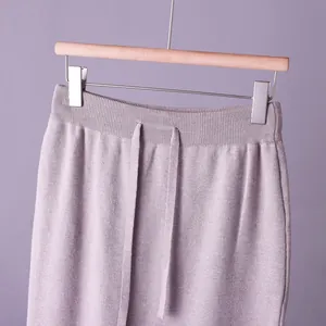 Detailed macro view of elastic ribbed waistband and knit drawstring on lavender purple skirt