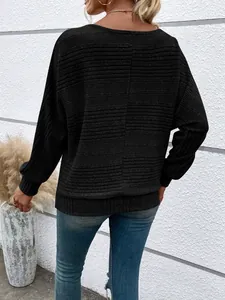 Rear view of black long-sleeve ribbed top with textured back seam detail